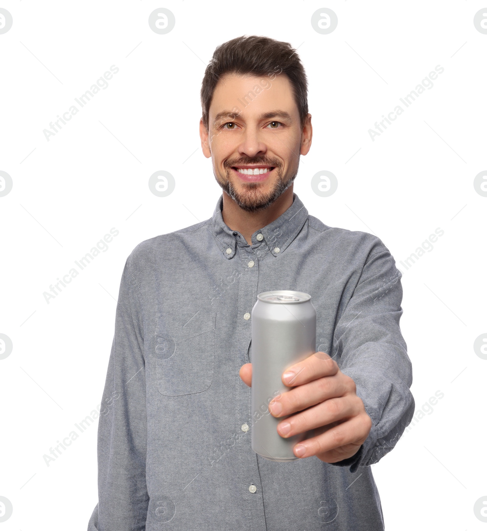 Photo of Happy man holding tin can with beverage on white background