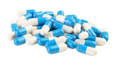 Pile of antibiotic pills isolated on white