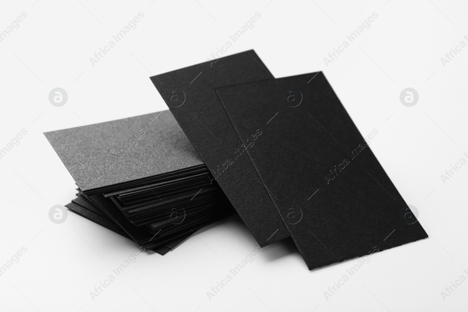 Photo of Blank black business cards on white background. Mockup for design