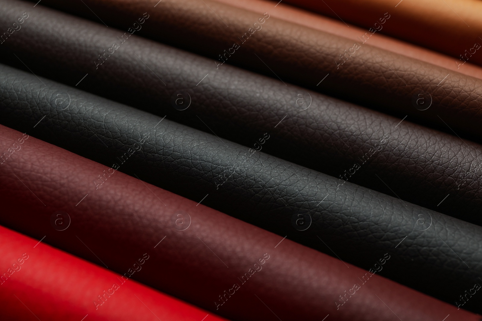 Photo of Different leather samples as background, closeup view