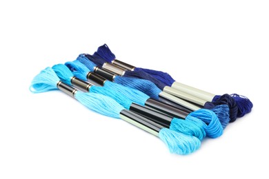 Photo of Set of colorful embroidery threads on white background