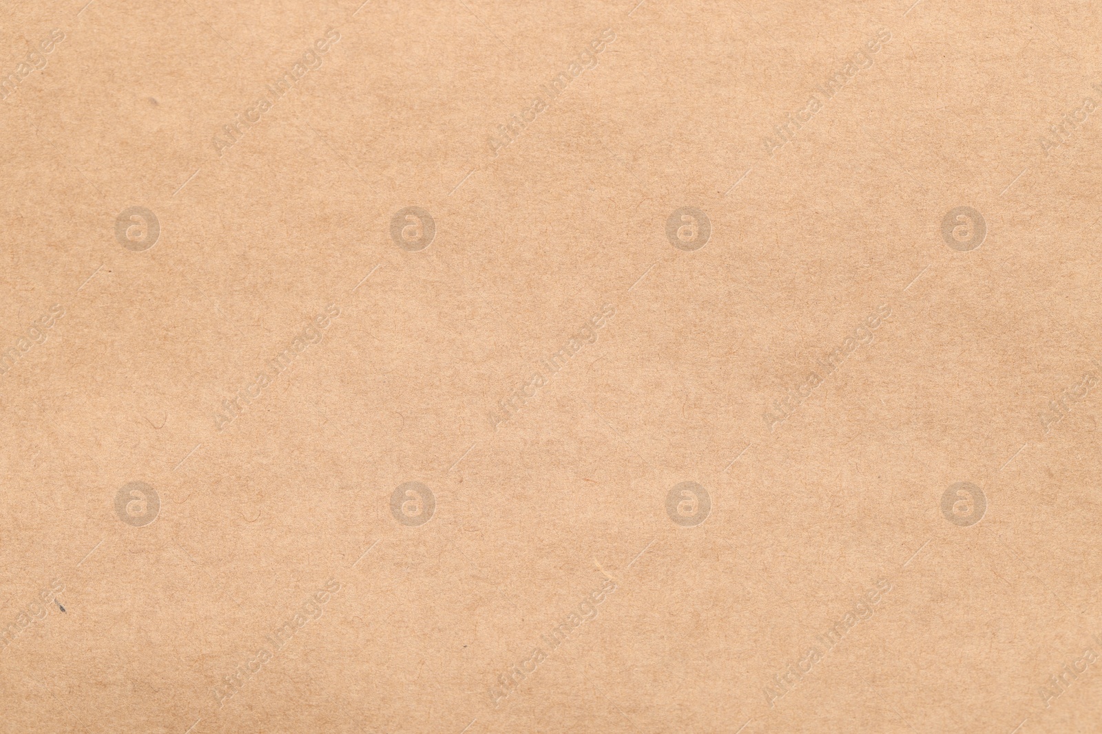 Photo of Texture of beige paper sheet as background, top view