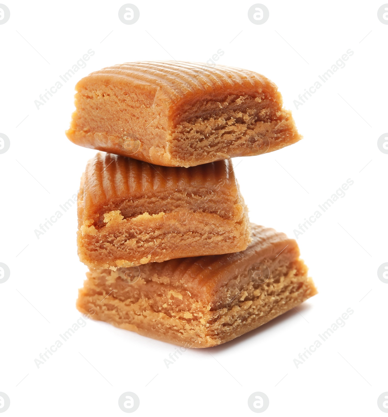 Photo of Delicious caramel candies on white background