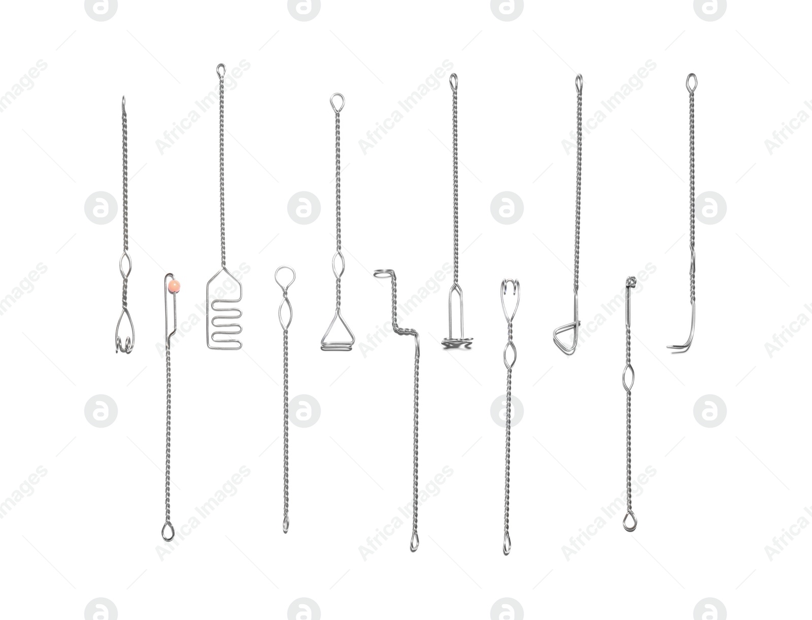 Photo of Set of logopedic probes on white background, top view. Speech therapist's tools