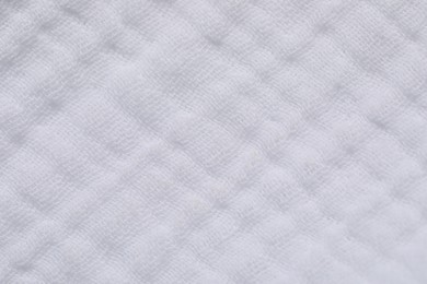 Texture of soft white fabric as background, top view