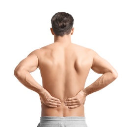 Young man suffering from back pain on white background