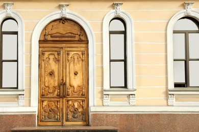 Photo of Closed vintage wooden door in old building