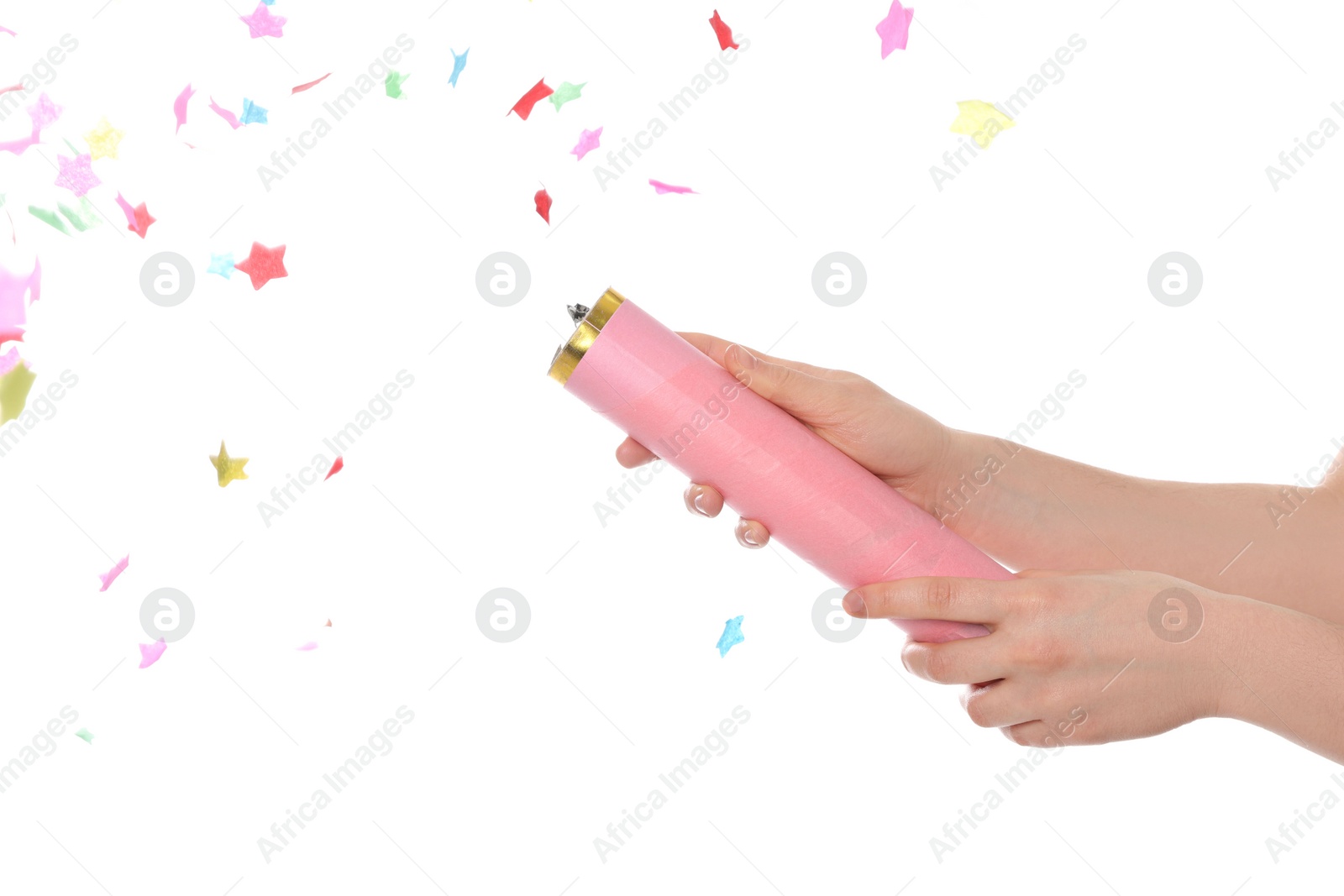 Photo of Young woman blowing up party popper isolated on white, closeup