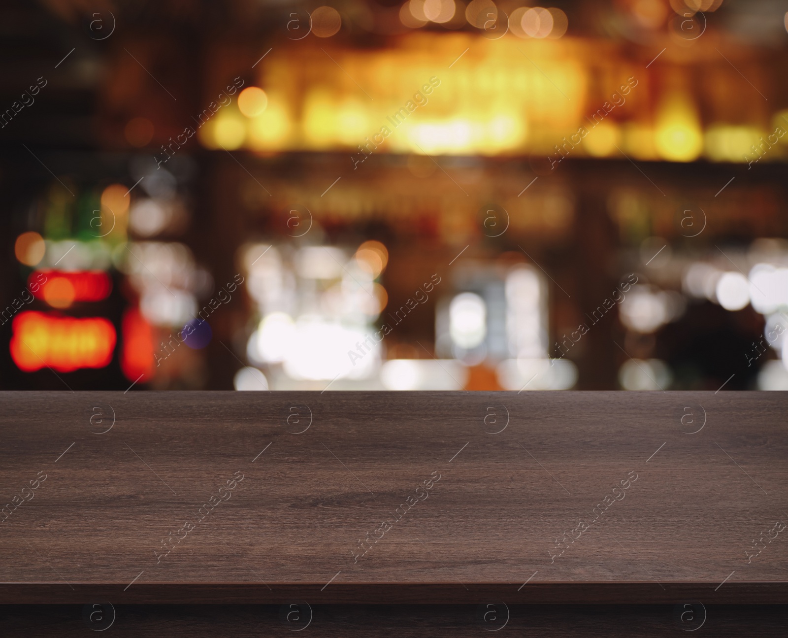 Image of Empty wooden surface and blurred view of bar interior. Space for design