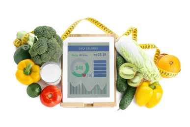 Photo of Tablet with weight loss calculator application, measuring tape and food products on white background, top view
