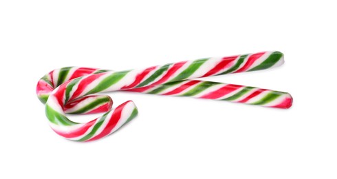 Photo of Sweet Christmas candy canes on white background