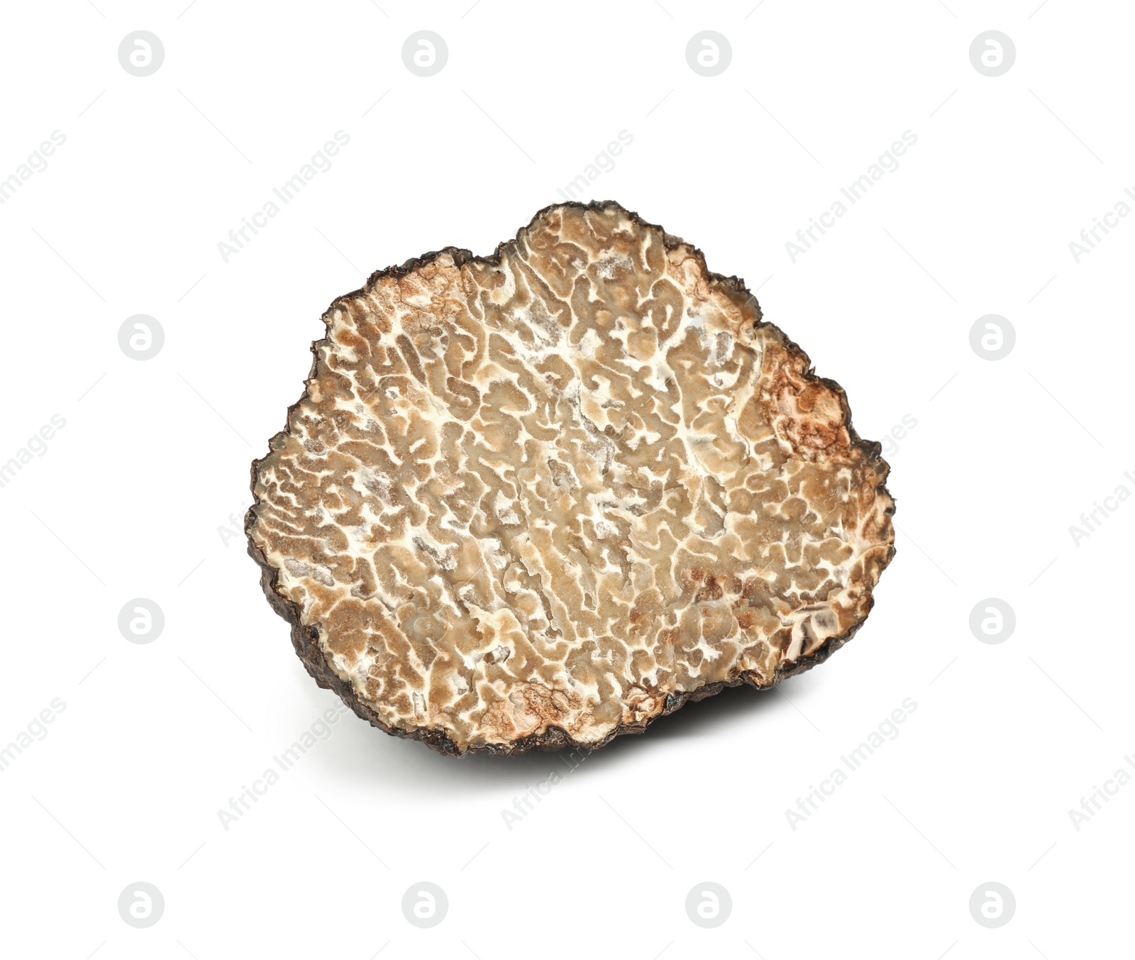 Photo of Cut fresh black truffle isolated on white