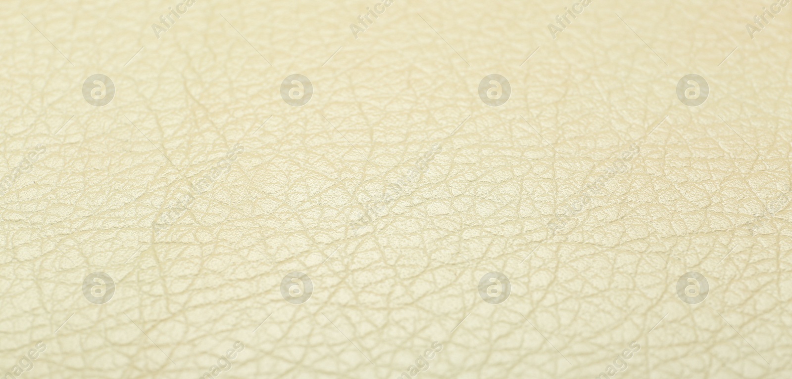 Photo of Texture of beige leather as background, closeup