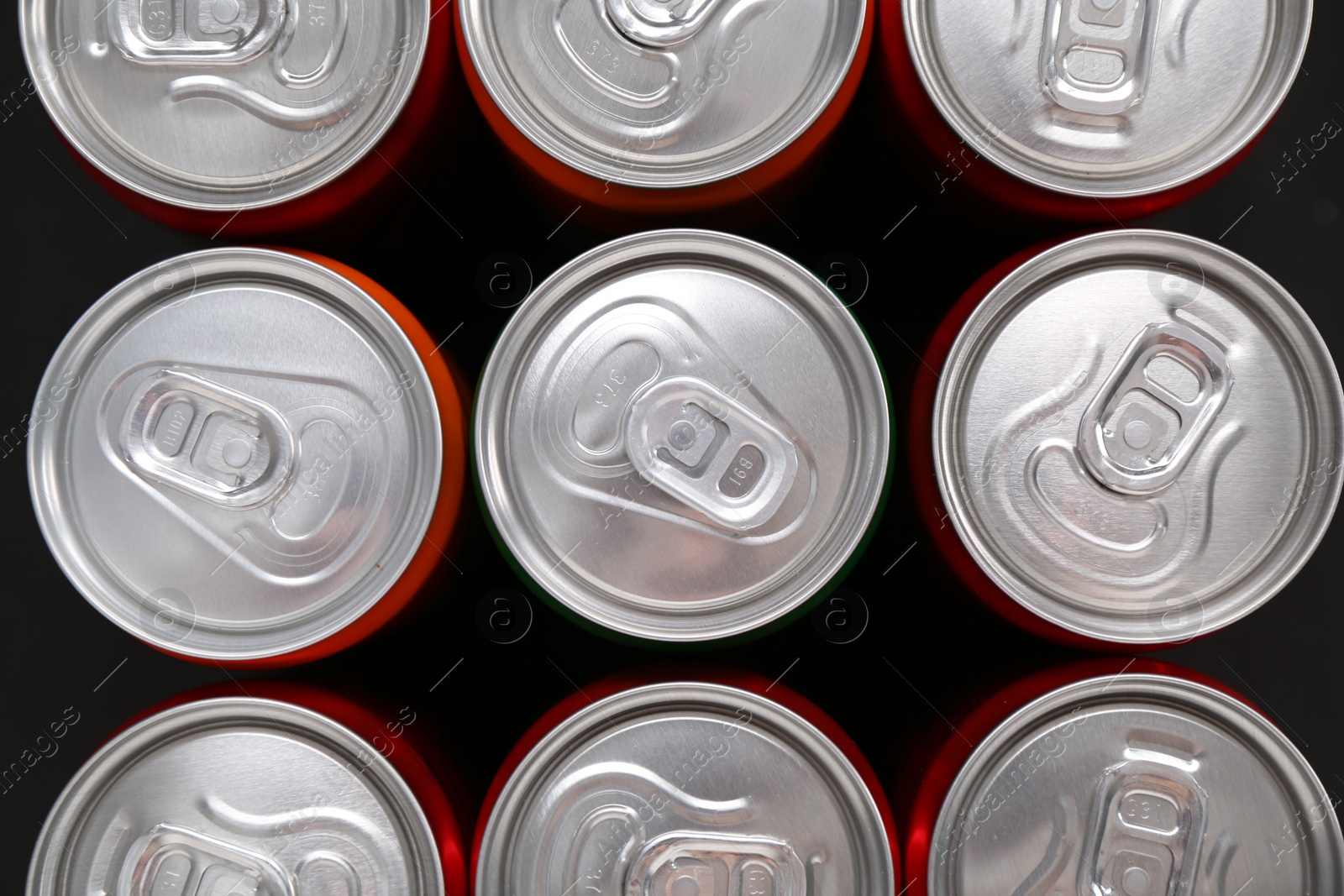 Photo of Energy drink in cans, top view. Functional beverage