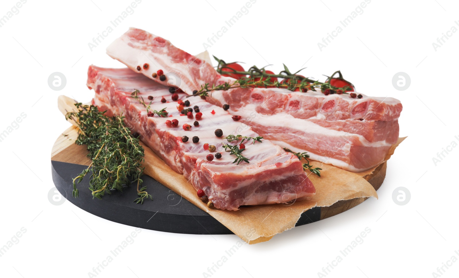 Photo of Raw pork ribs with spices and tomatoes isolated on white