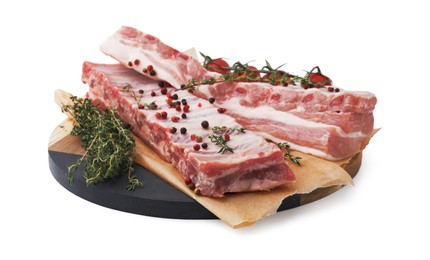 Raw pork ribs with spices and tomatoes isolated on white