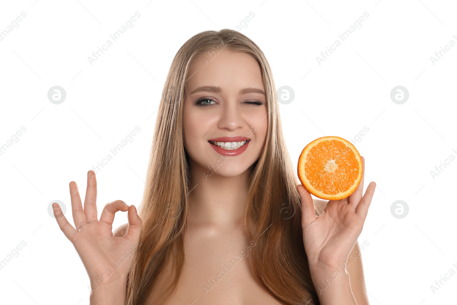 Photo of Young woman with cut orange and grapefruit on white background. Vitamin rich food