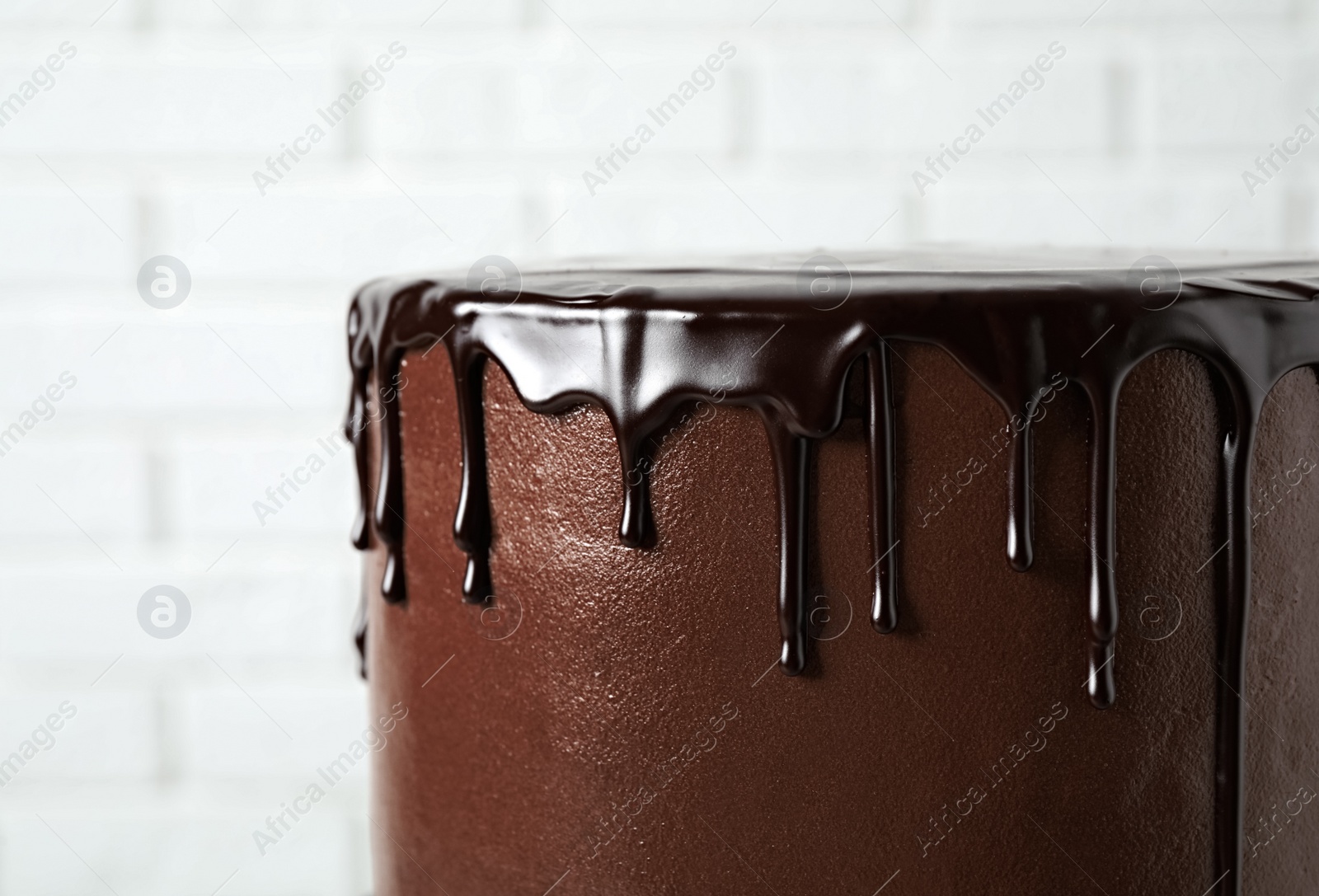 Photo of Freshly made delicious chocolate cake against white background, closeup