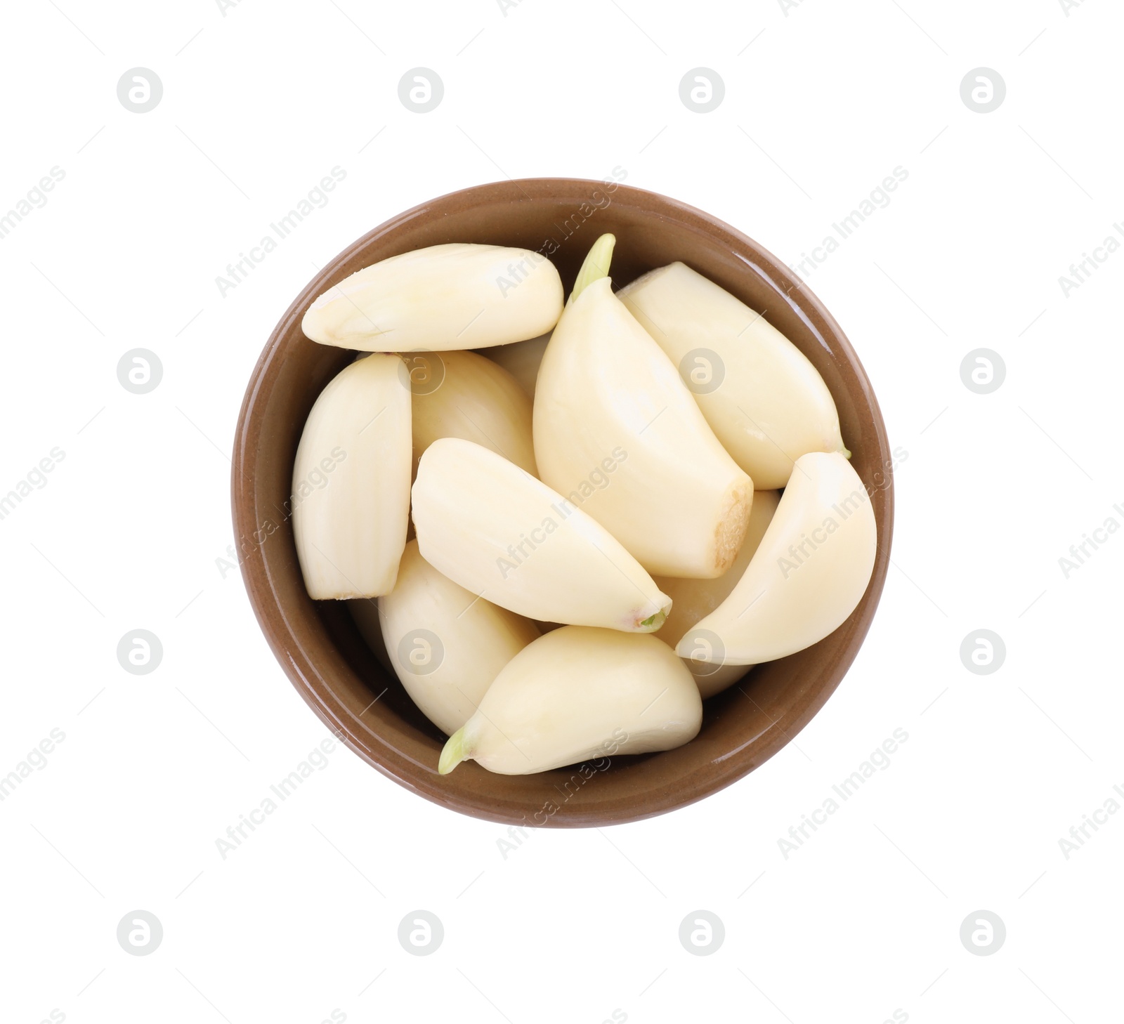 Photo of Peeled cloves of fresh garlic in bowl isolated on white, top view