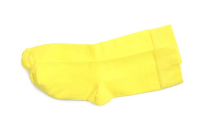Photo of Pair of yellow socks on white background, top view