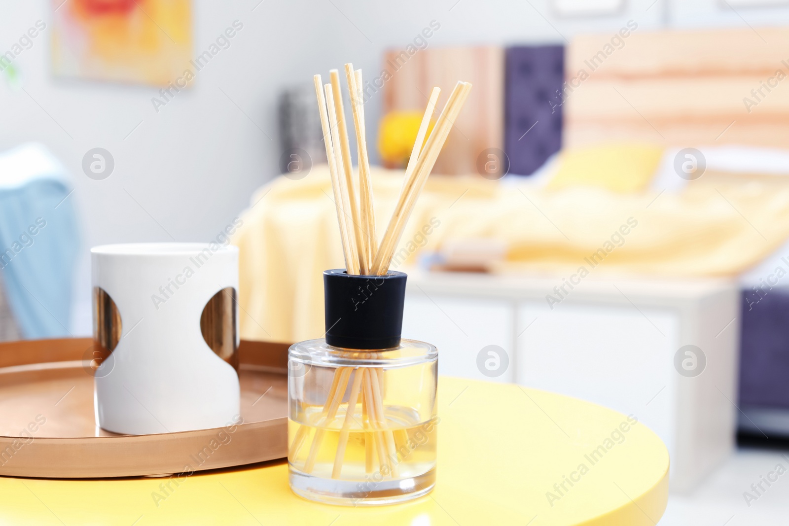 Photo of Reed freshener on table in bedroom