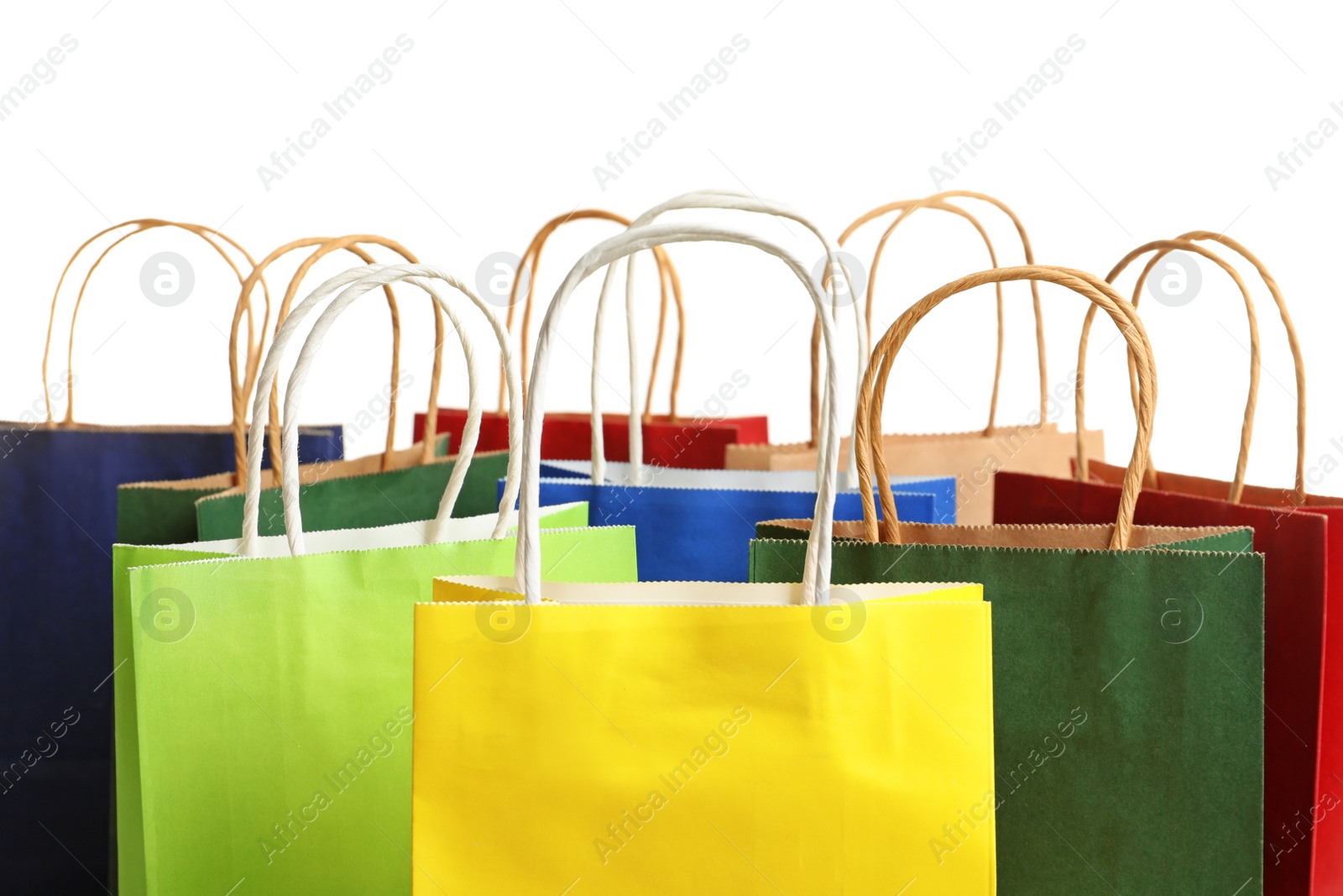 Photo of Colorful paper shopping bags on white background