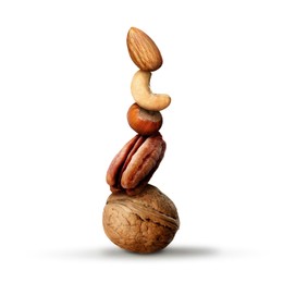 Image of Stack of different nuts on white background