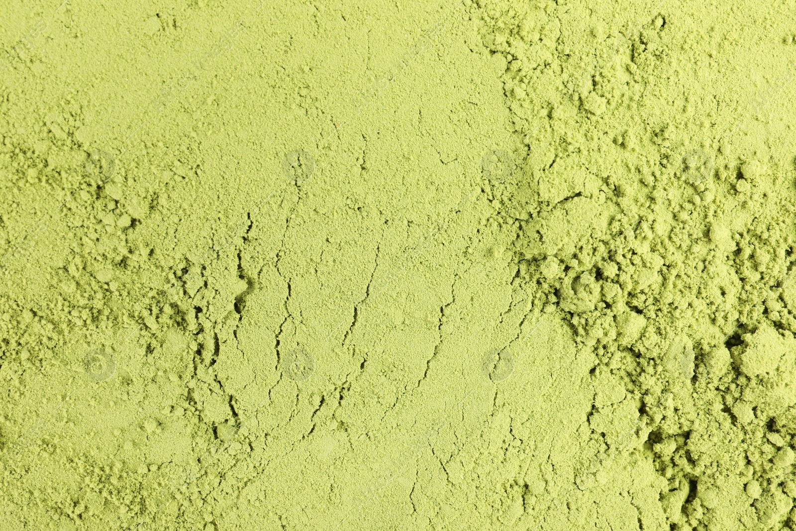 Photo of Green matcha powder as background, top view