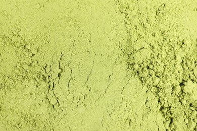 Photo of Green matcha powder as background, top view