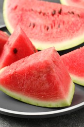 Photo of Delicious fresh watermelon slices on plate, closeup