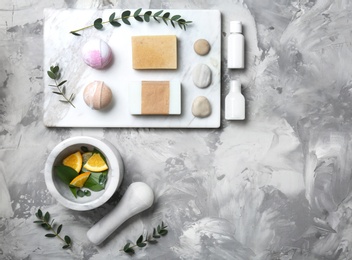 Photo of Beautiful composition with spa cosmetics on grey background