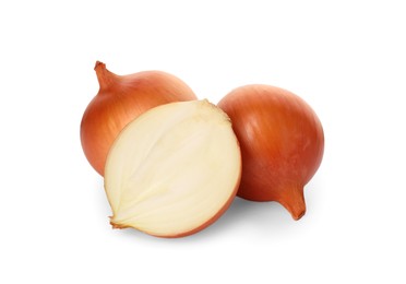Photo of Whole and cut onions on white background