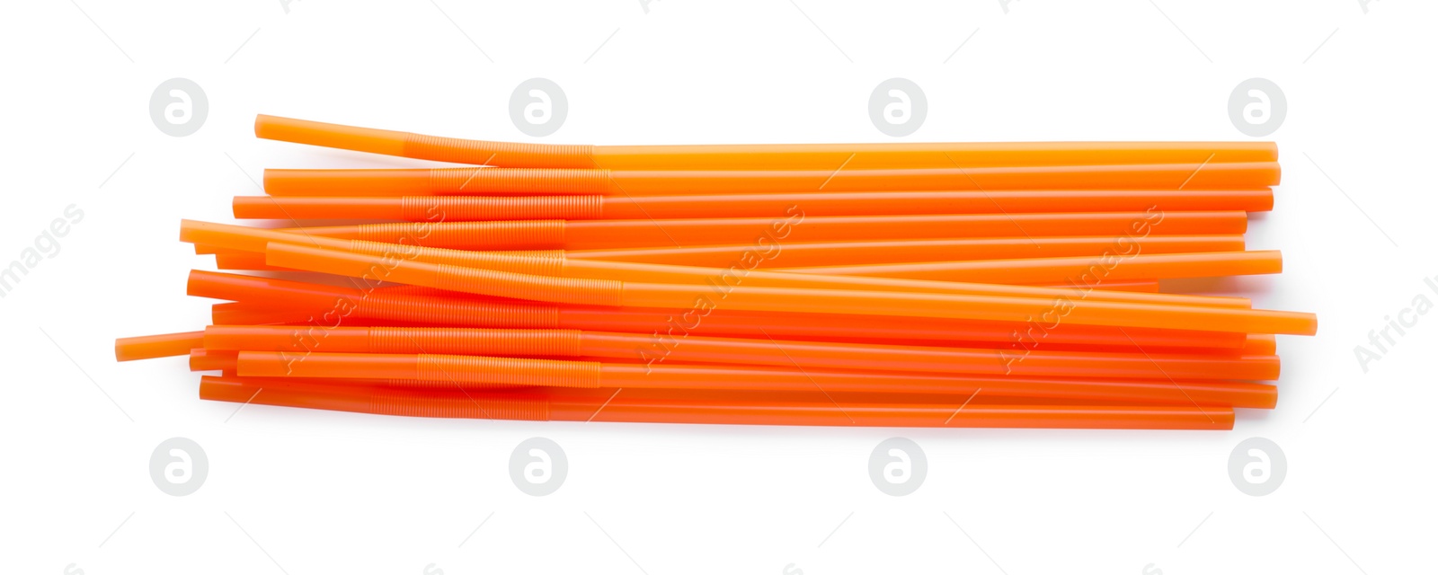 Photo of Orange plastic cocktail straws on white background, top view