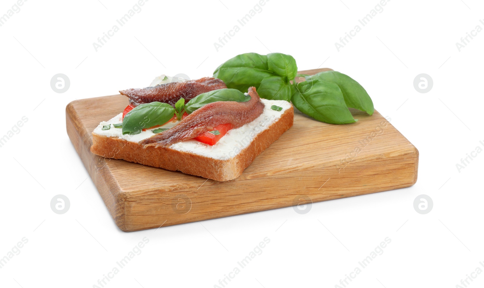 Photo of Delicious sandwich with cream cheese, anchovies, tomatoes and basil on white background