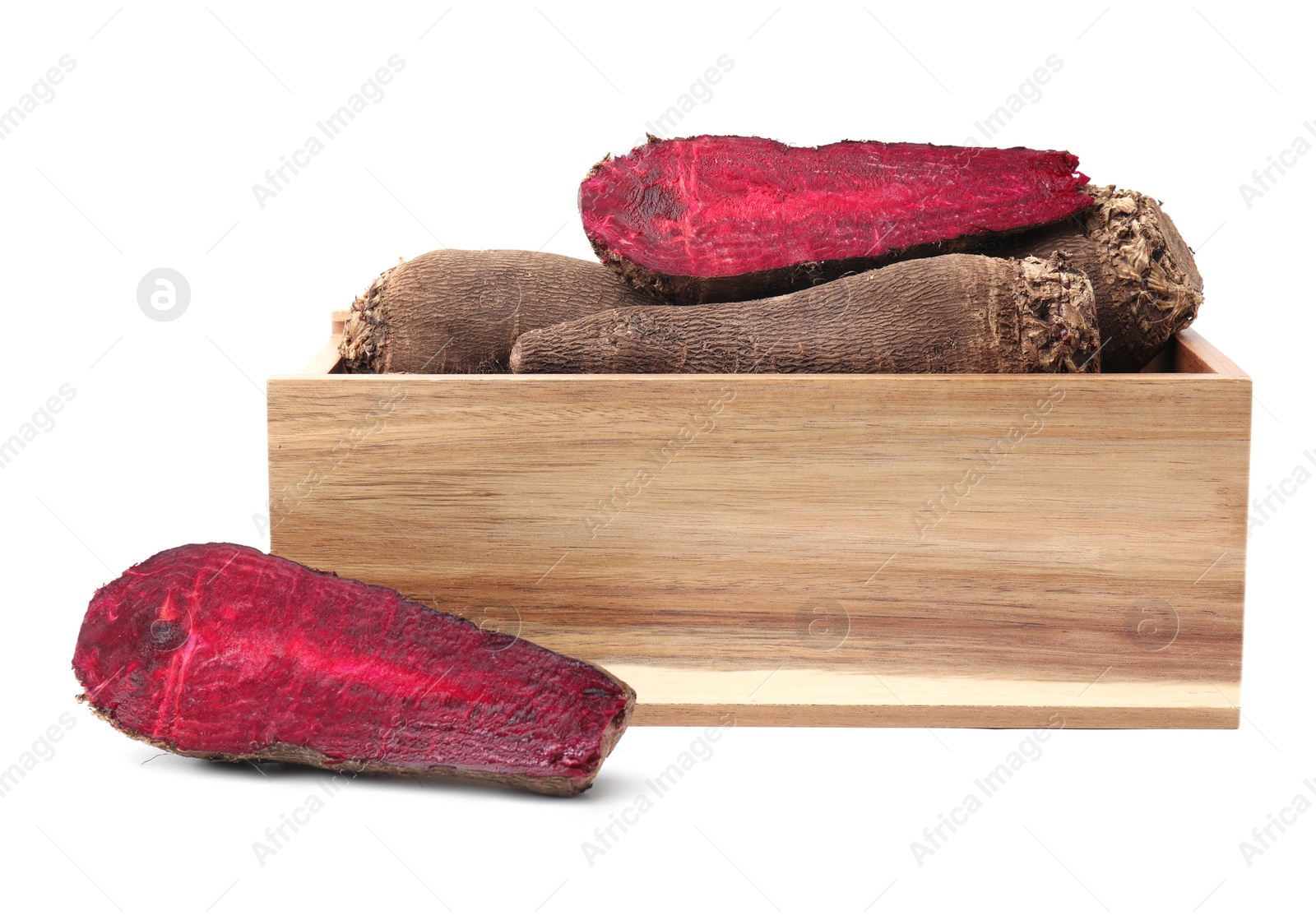 Photo of Whole and cut red beets in wooden crate isolated on white