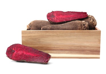 Whole and cut red beets in wooden crate isolated on white