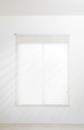 Photo of Modern window with open blinds in room