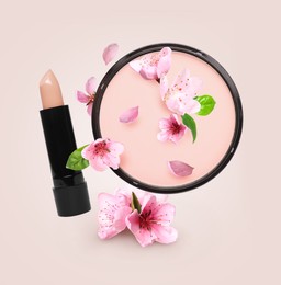 Image of Spring flowers and makeup products in air on beige background