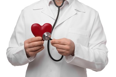 Doctor with stethoscope and red heart on white background, closeup. Cardiology concept