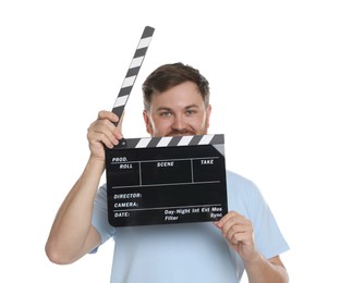 Making movie. Man with clapperboard on white background