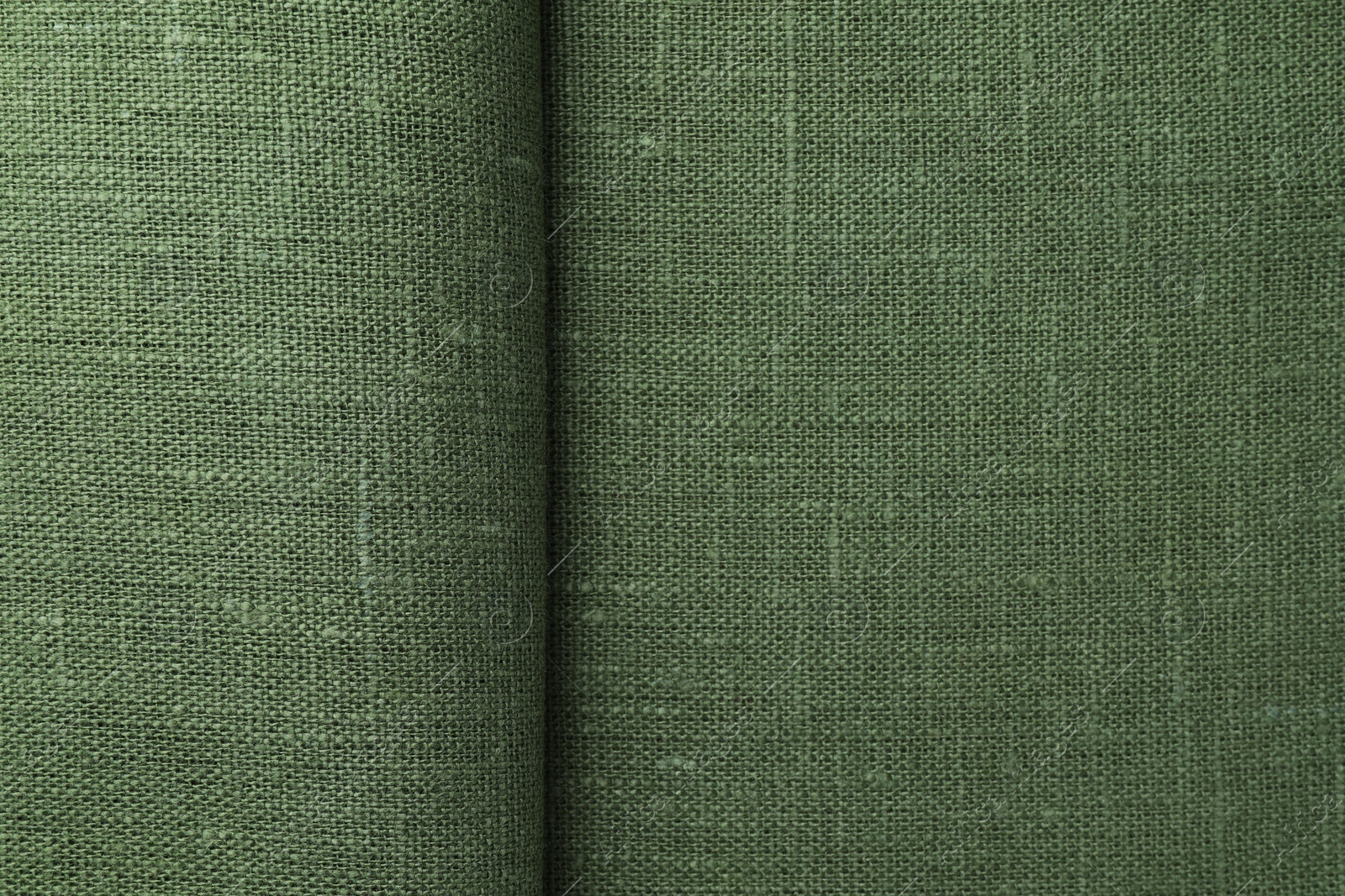 Photo of Texture of green fabric as background, top view