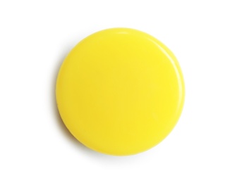 Bright yellow plastic magnet on white background, top view