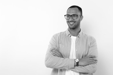 Image of Portrait of handsome young man on light background, space for text. Black and white effect