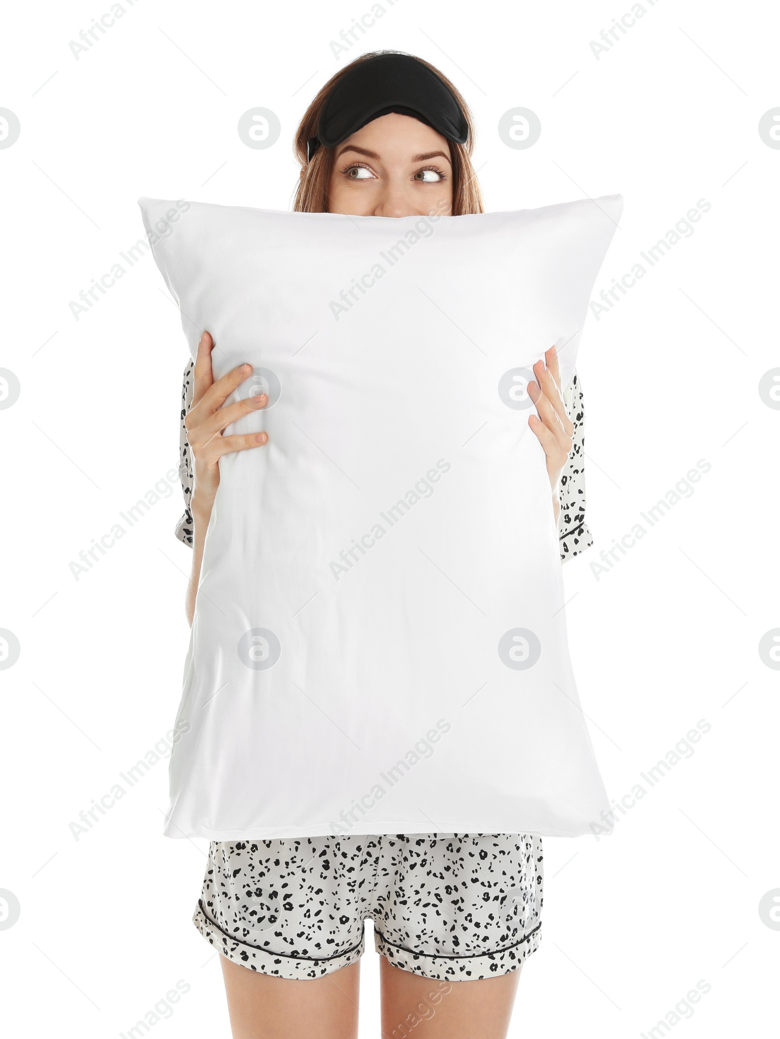 Photo of Beautiful woman with pillow and sleep mask on white background. Bedtime