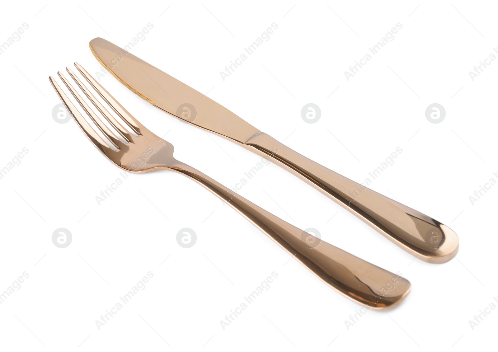 Photo of New shiny fork and knife on white background