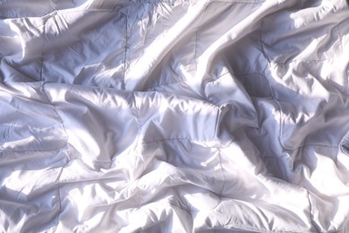 Photo of Soft white crumpled blanket as background, closeup