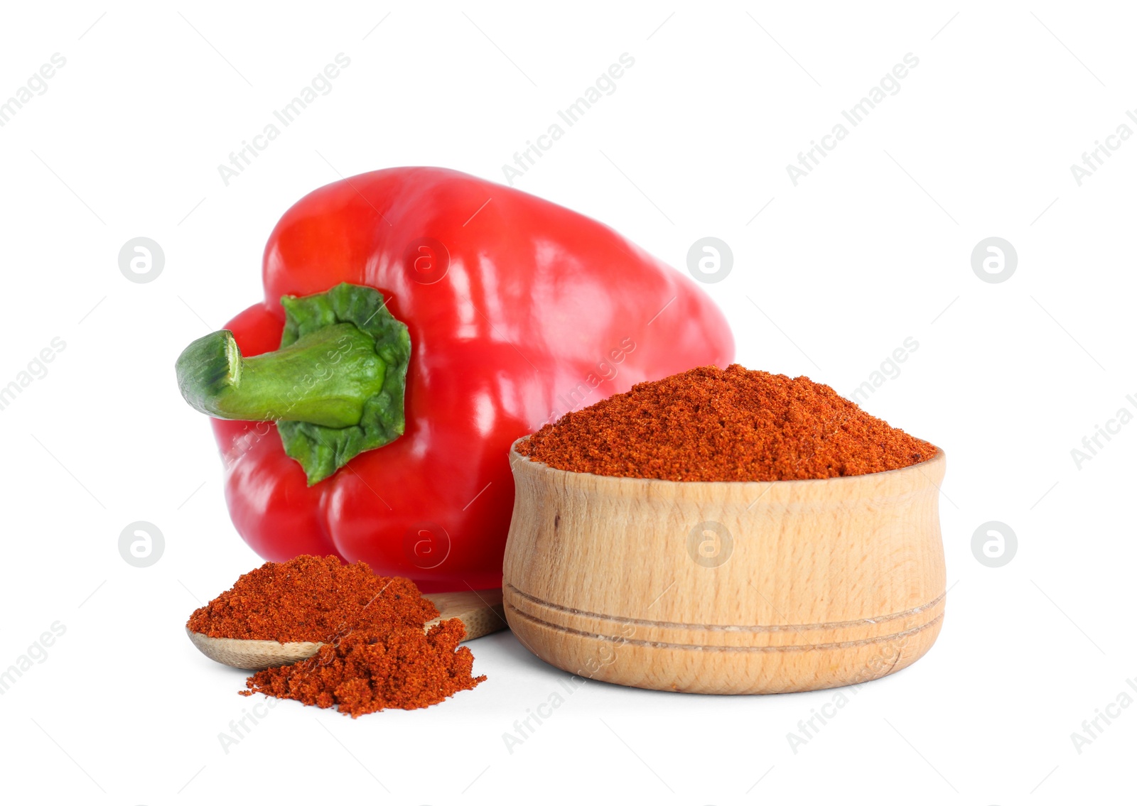 Photo of Fresh bell pepper and bowl of paprika powder on white background