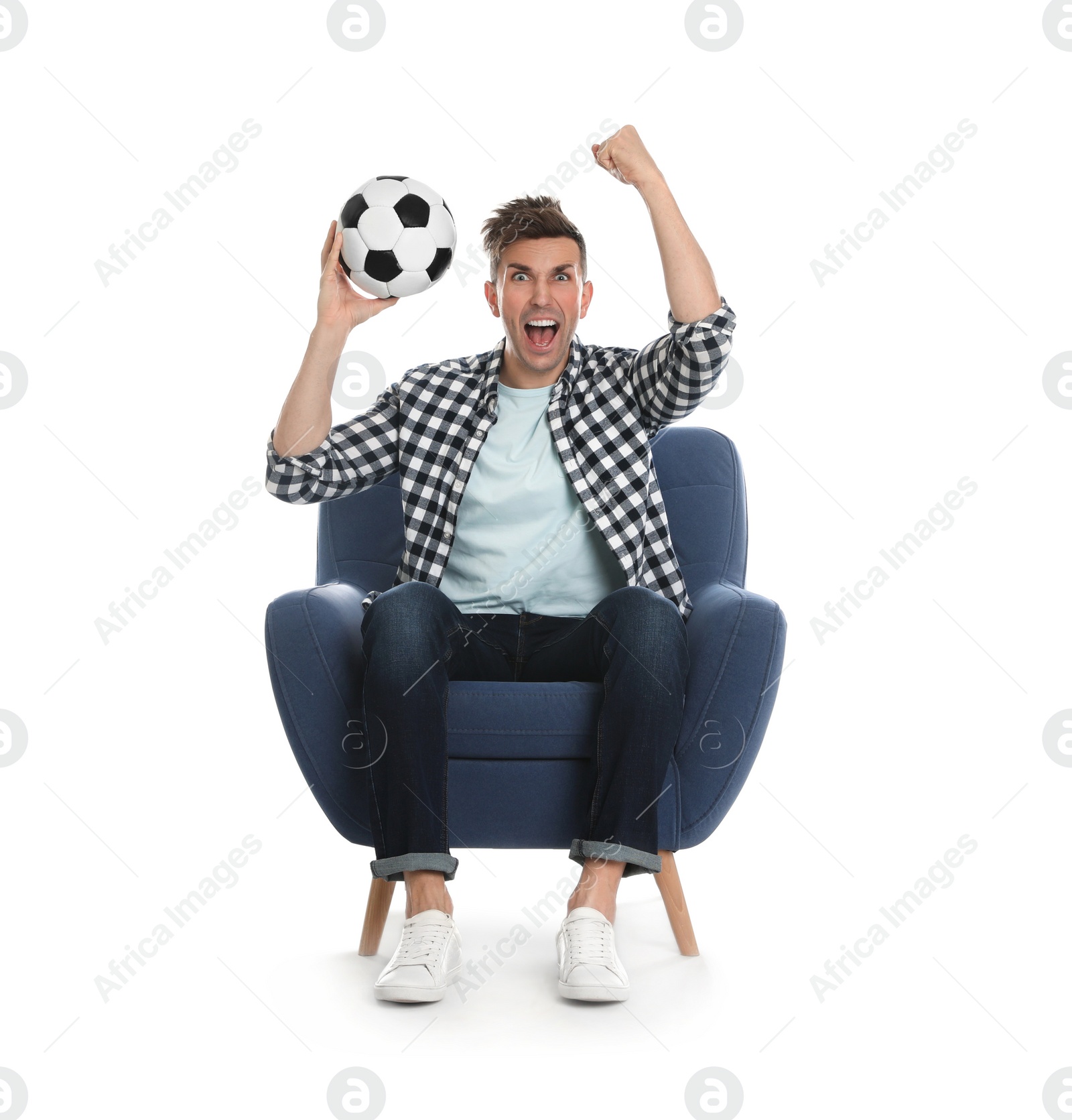 Photo of Handsome young man sitting in armchair and watching soccer match on white background