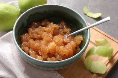 Photo of Delicious apple jam and fresh fruits on grey table, closeup