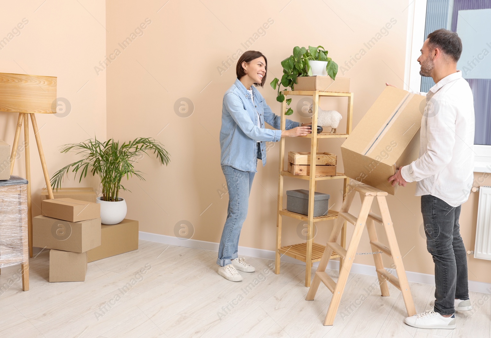 Photo of Happy couple in new apartment. Moving day